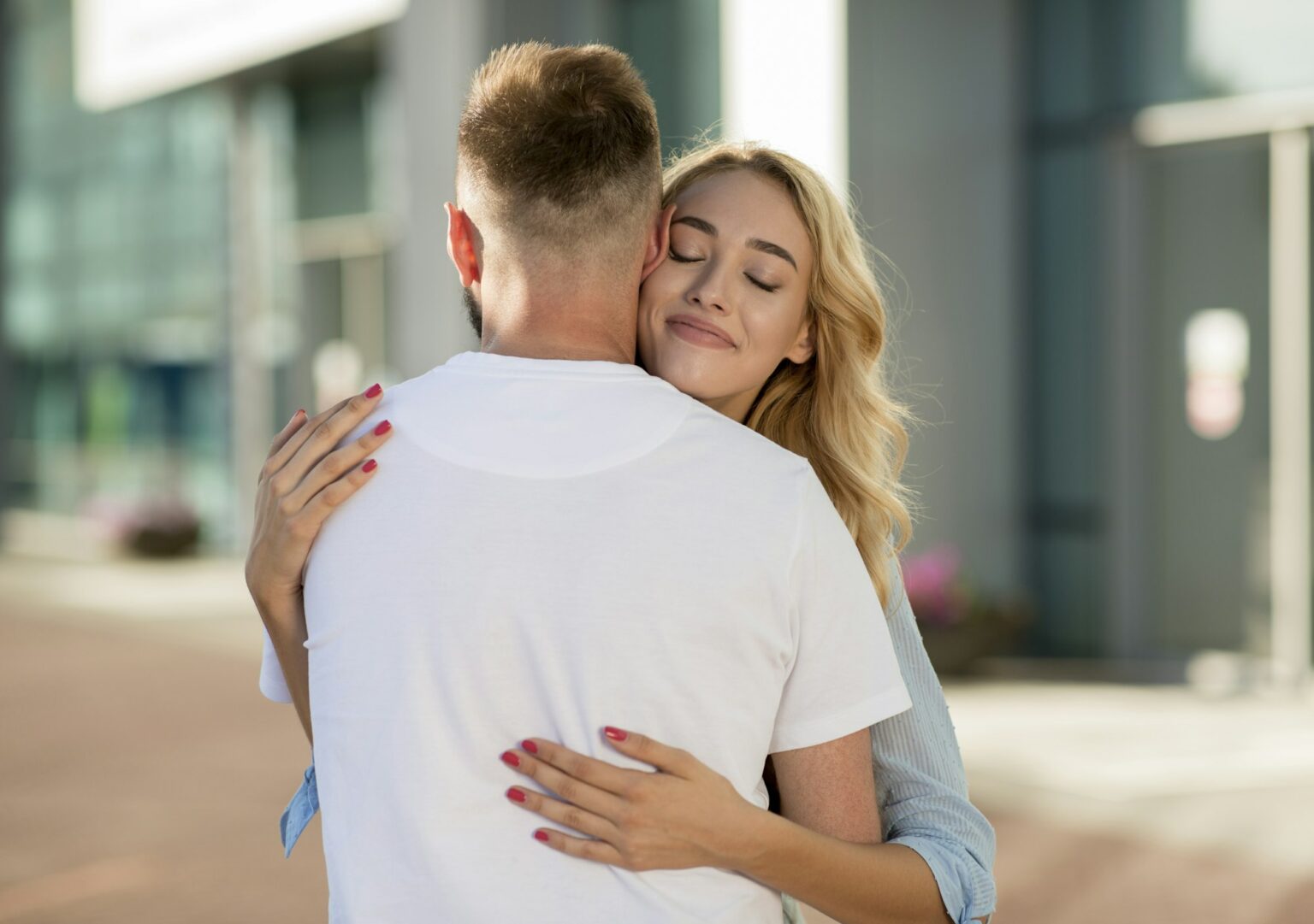 Man picking up his wife near the airport building
