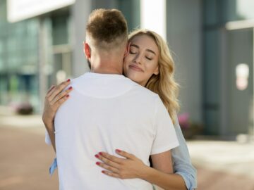 Man picking up his wife near the airport building