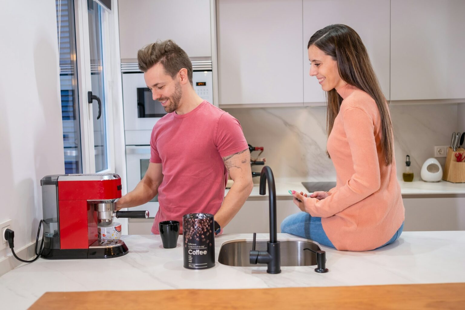 Couple in the kitchen in the morning