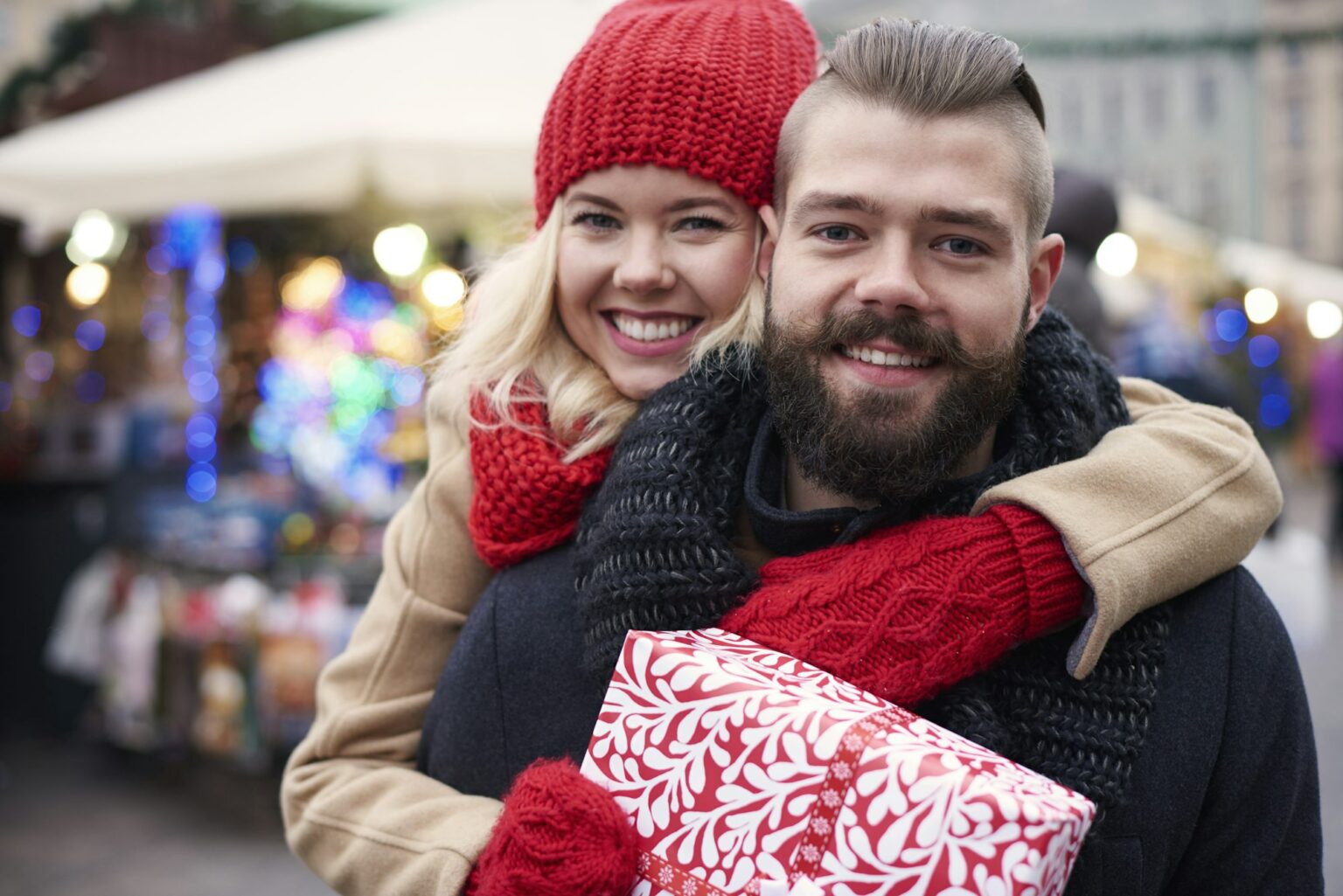 Happy couple with big gift box