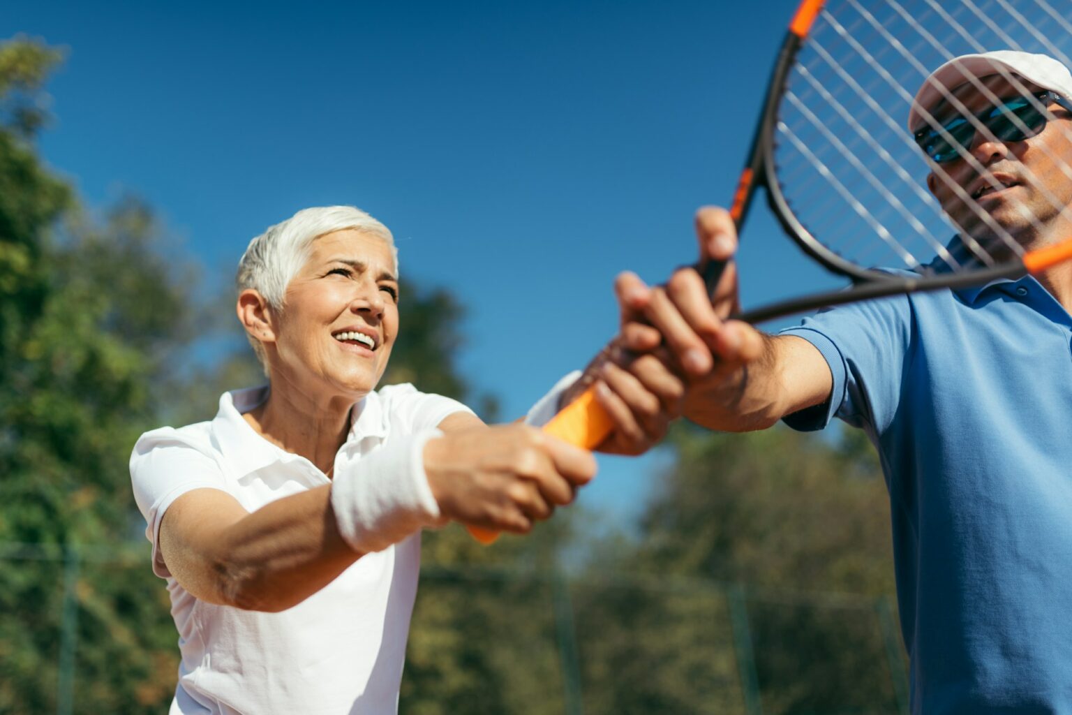 Mature Woman Playing Tennis